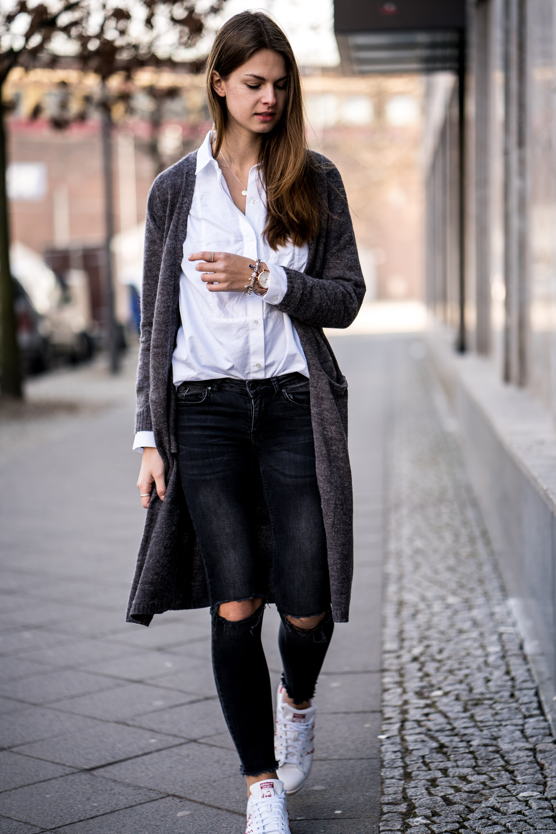 torn jeans and white shirt