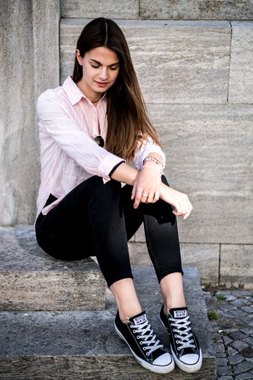 black jeans and pink shirt