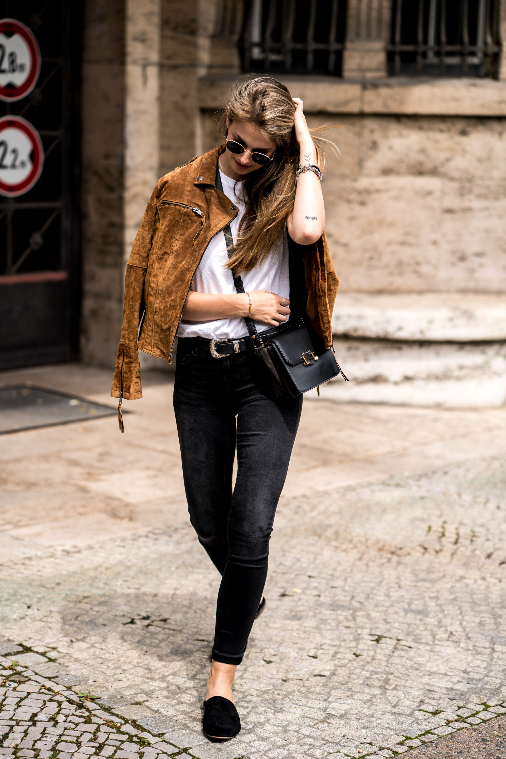 brown leather jacket with black dress