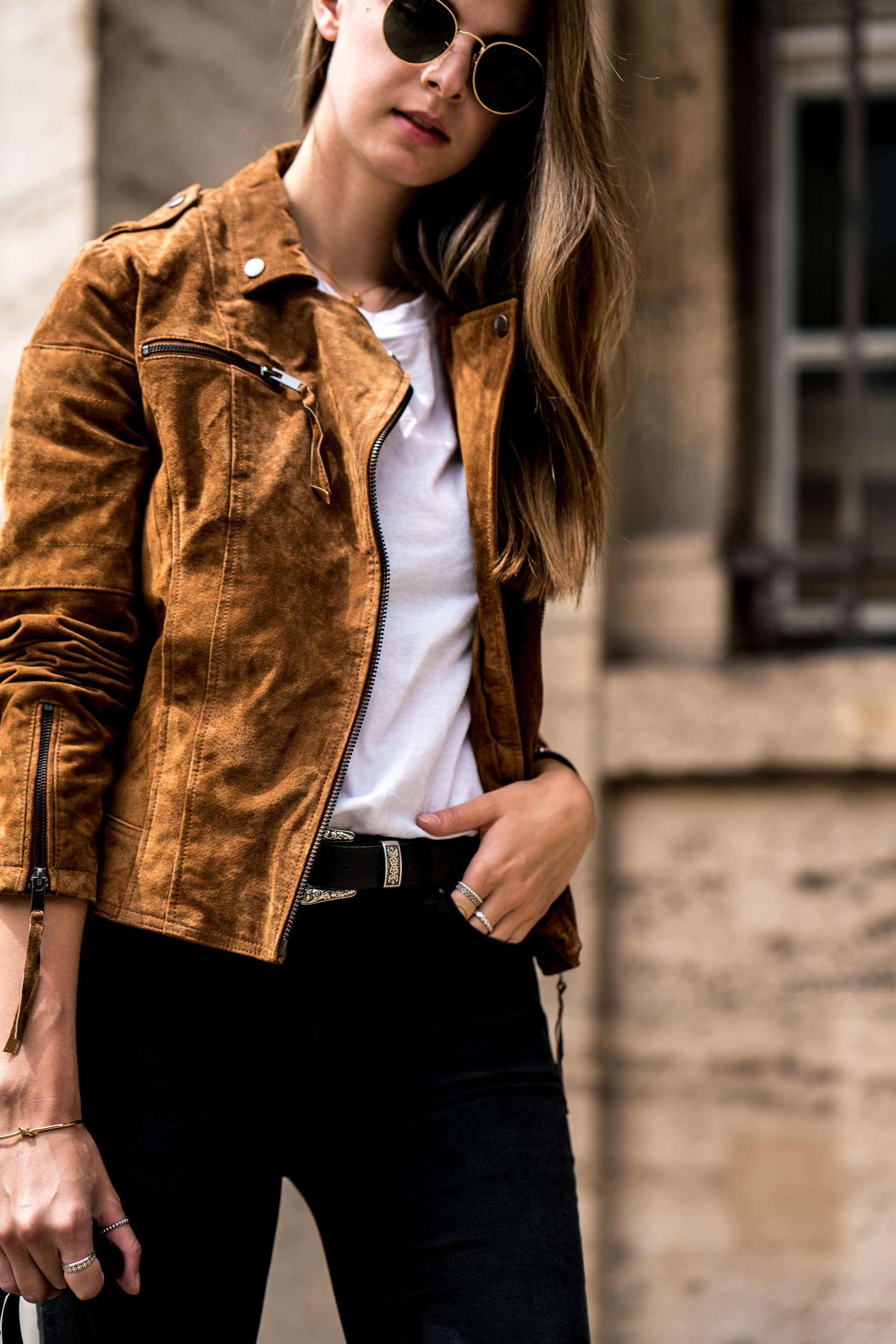 brown leather jacket with black dress