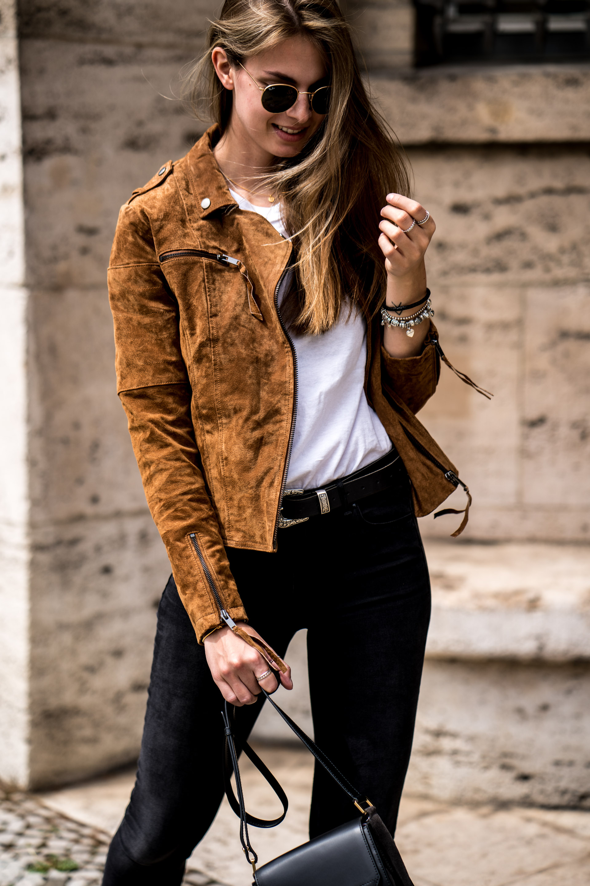 brown leather jacket with black dress