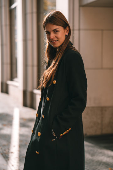 black coat with golden buttons