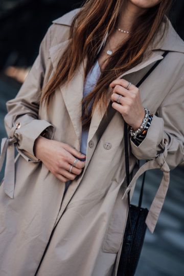 Trench coat with lacing on the arm