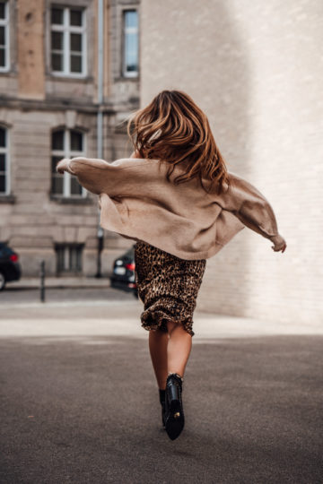 combining a leo print skirt and cardigan