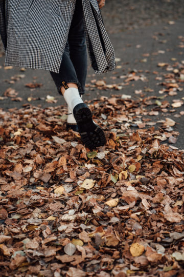 Combining white Dr. Martens with a trench coat