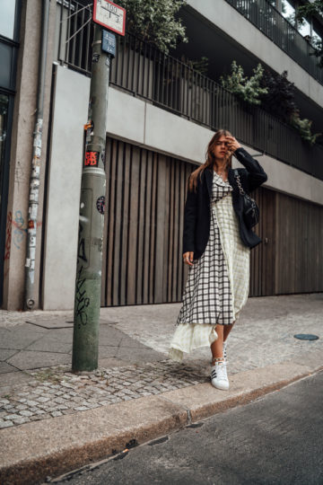 combining a midi dress with Sneakers